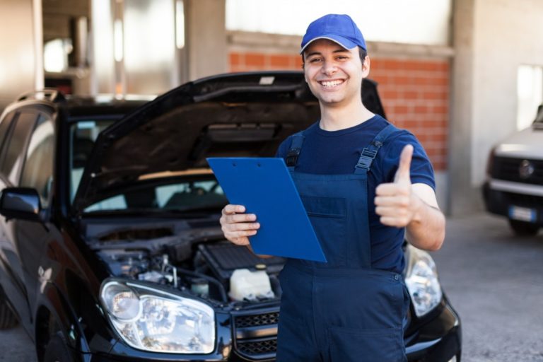 Man giving thumbs up after checking car parts