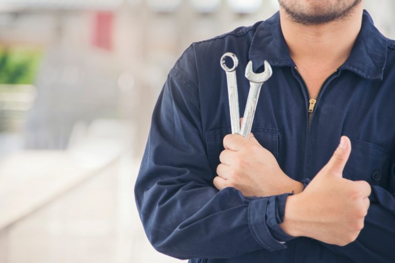 auto mechanic giving a thumbs up