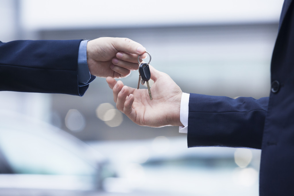 man receiving car keys