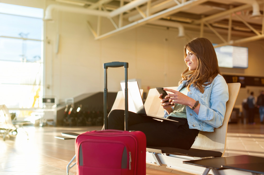 woman at the airport with a luggage