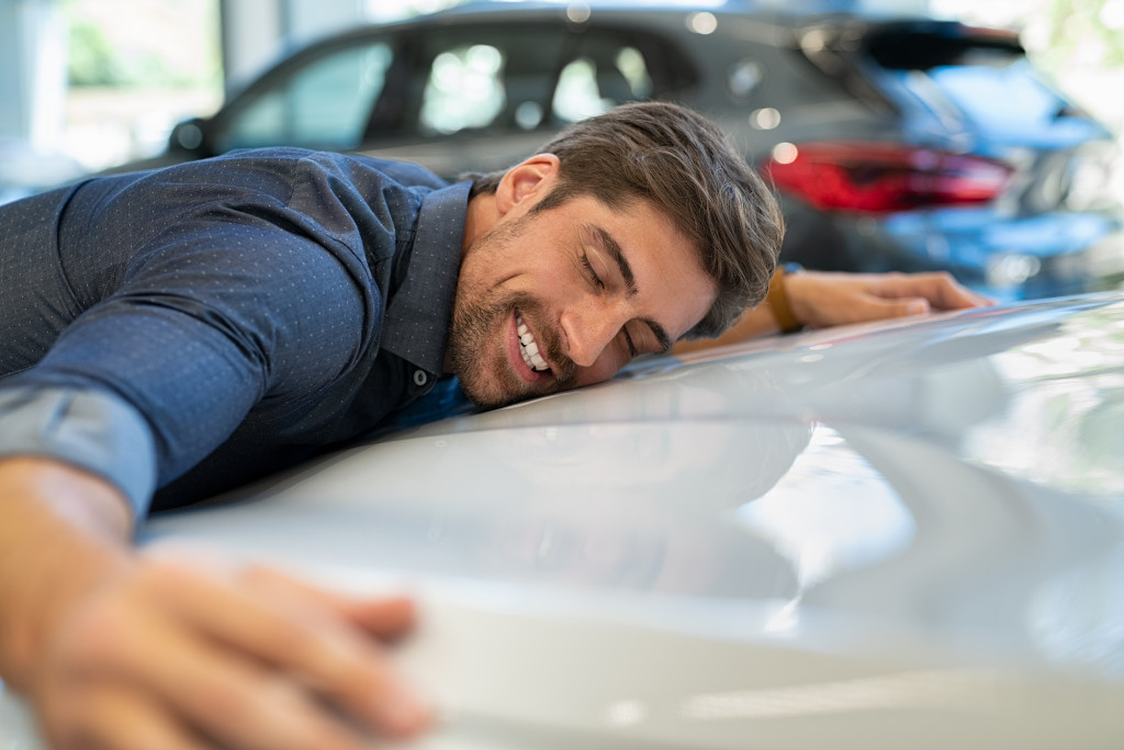 A car owner loving his car