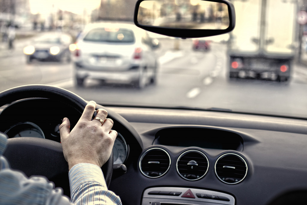 a man driving a car